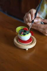 Intangible heritage dough sculpture, hand painting puffer fish dough figurine © Lijuan