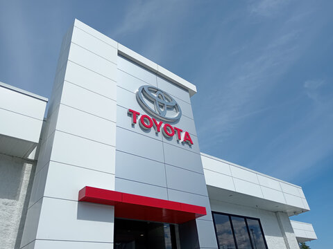 Penticton, Canada - June 22, 2026: The exterior of a Toyota dealership in Penticton Canada shows several vehicles for sale. The brand logo is visible on the building.