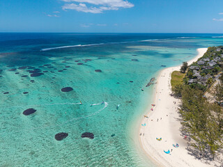 Kitesurfers in the turquoise lagoon at Le Morne, Mauritius © Philippe