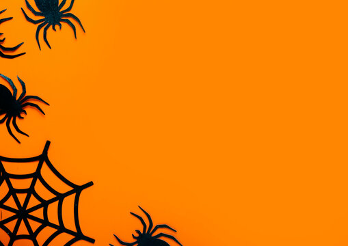 Halloween background with black crawling spiders and web corner on bright orange texture. Spooky insects border concept. Scary celebration decor template for party invitation poster banner