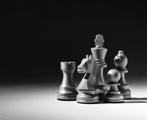 Black and White Dramatic Chess Pieces with Copy Space © stokkete