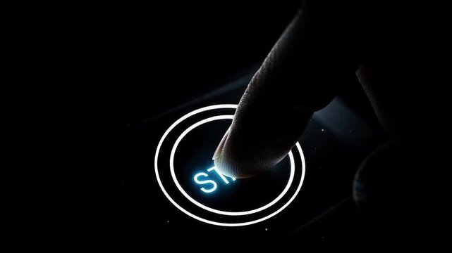 Finger Pressing Glowing Start Button on Dark Surface Cinematic Tech Launch Concept