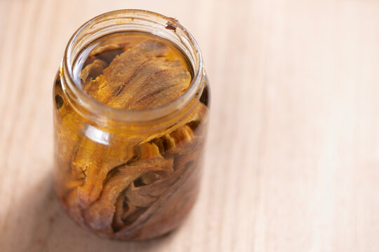 bottle of salted anchovies in olive oil