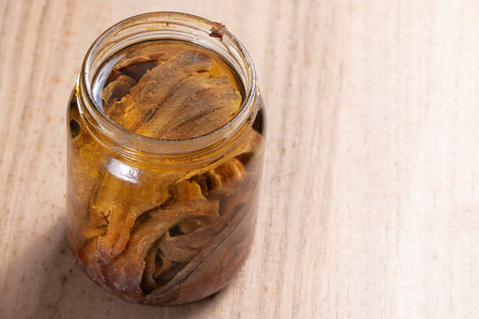 bottle of salted anchovies in olive oil