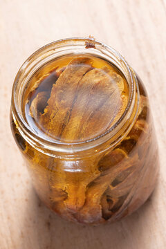 bottle of salted anchovies in olive oil