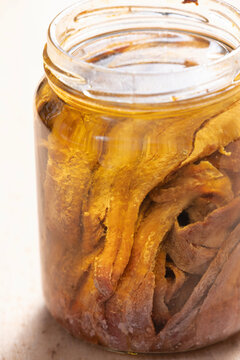 bottle of salted anchovies in olive oil