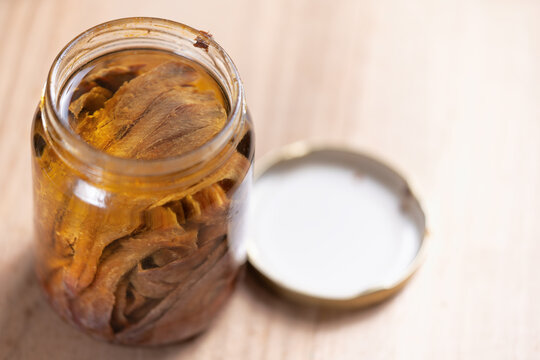bottle of salted anchovies in olive oil