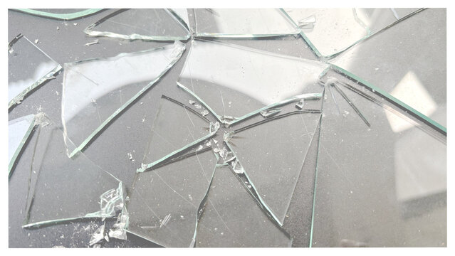 Close-up of shattered glass fragments on a transparent checkerboard preview, sharp edges and cracked glass overlay texture