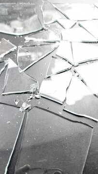 Shattered glass fragments on a checkerboard preview background, cracked transparent texture for digital effects and photo editing