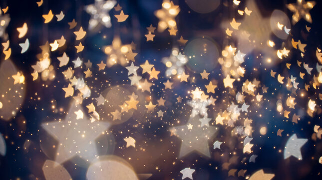 Magical bokeh background with sparkling golden and white stars on a dark blue backdrop