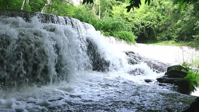 Chet Sao Noi Waterfall, a beautiful waterfall amidst the forest at Chet Sao Noi Waterfall National Park, Thailand.