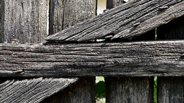 Wooden texture old boards. vintage boards and old rusty nails. Abstract texture of old boards. the wood is destroyed. wood texture. knots, imperfect surface. Closeup of an old wooden fence. background