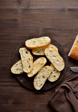 Slices of ciabatta bread on cutting board