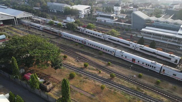 Aerial Footage of Passenger Train Carriages Lined Up at Purwokerto Railway Station in the Morning, Central Java, Indonesia.