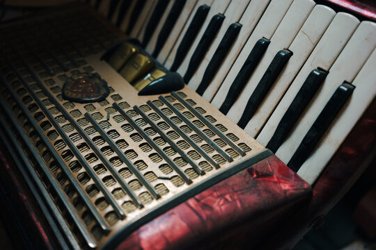 Details of an old dusty accordion