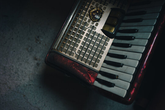 Details of an old dusty accordion