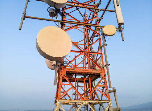 Aerial View of Telecommunication Tower with Radio Masts and Equipment in the Morning in Purwokerto, Central Java, Indonesia.