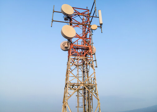 Aerial View of Telecommunication Tower with Radio Masts and Equipment in the Morning in Purwokerto, Central Java, Indonesia.
