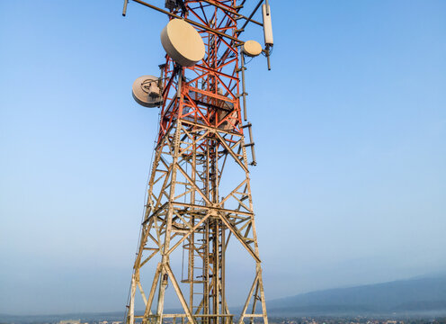 Aerial View of Telecommunication Tower with Radio Masts and Equipment in the Morning in Purwokerto, Central Java, Indonesia.