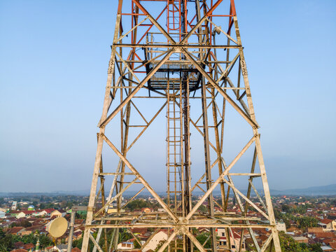 Aerial View of Telecommunication Tower with Radio Masts and Equipment in the Morning in Purwokerto, Central Java, Indonesia.