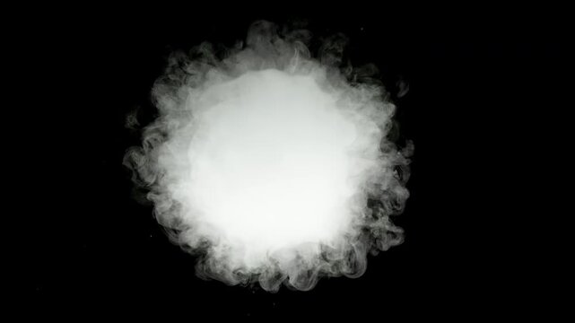 An isolated puff of smoke expands and disperses against a black background, filmed at 1,000 frames per second. The detailed slow-motion movement makes it suitable as a smoke overlay for video composit
