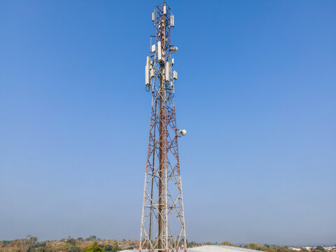 Aerial View of a Telecommunication Tower with Radio Masts and Equipment Surrounded by Trees in Purwokerto, Central Java, Indonesia.