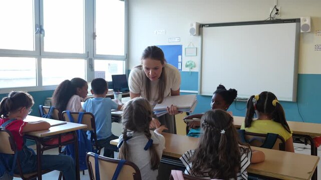 Caucasian female teacher scolding a group of multiethnic elementary school students sitting at their desks during a lesson in a classroom
