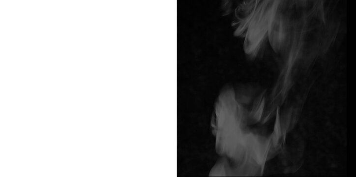 White steam rising and swirling on black and transparent background for atmosphere creation.