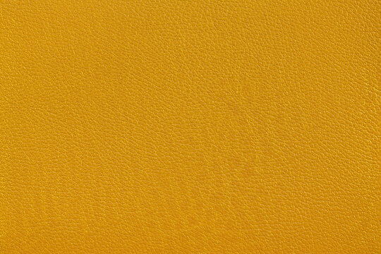 Mustard yellow faux leather texture background