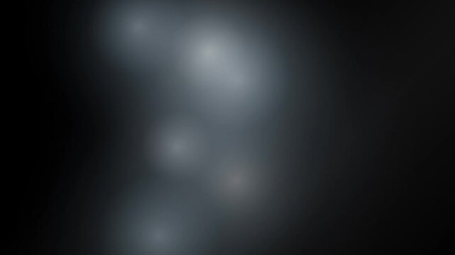Abstract luminous smoke or fog swirling with soft light effects and diffused glow