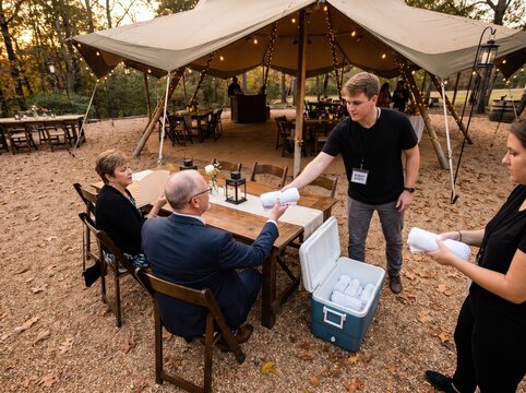 Staff Offering Drinks At Outdoor Wedding, Southern Hemisphere Holiday Heat Safety