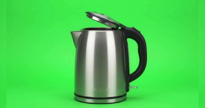 Stainless Steel Electric Water Kettle with Open Lid Isolated on Green Screen Background