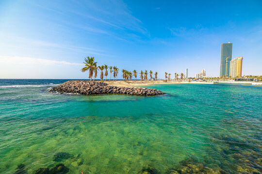 Jeddah Waterfront in Saudi Arabia showcases the city's coastal charm, combining sparkling turquoise waters, relaxing beachfront scenery, and a striking modern skyline under sunny skies.