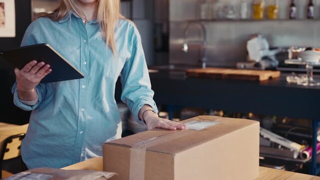Store worker preparing shipment for customer.