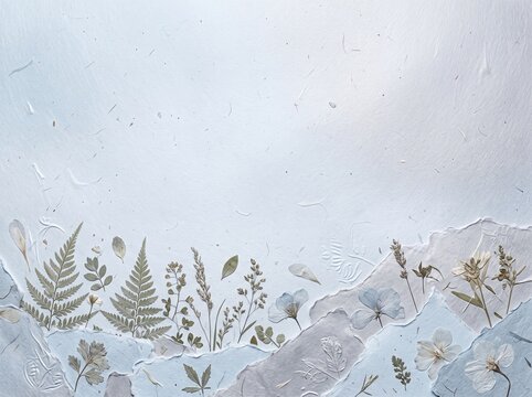 Pressed dried flowers and ferns on handmade paper