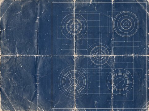 Aged blueprint paper with technical engineering drawings