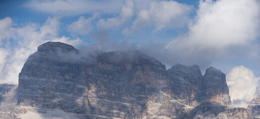 Fototapeta premium Mountain landscape panorama Tre Cime Mount against a blue summer background. 