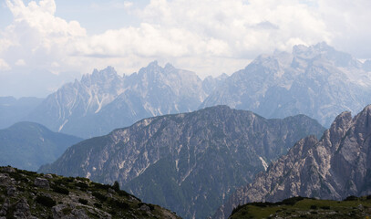 Fototapeta premium Mountain landscape panorama Tre Cime Mount against a blue summer background. 