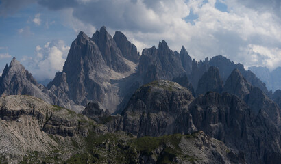 Fototapeta premium Mountain landscape panorama Tre Cime Mount against a blue summer background. 
