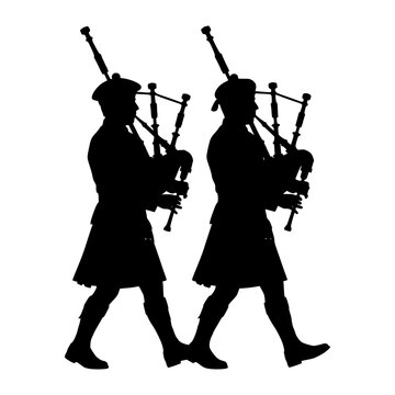 Two scottish bagpipers silhouette playing traditional music for