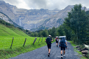 Fototapeta premium Hiking trail to Gavarnie Falls, spectacular waterfall in french Pyrenees, highest waterfalls in France, popular tourist landmark