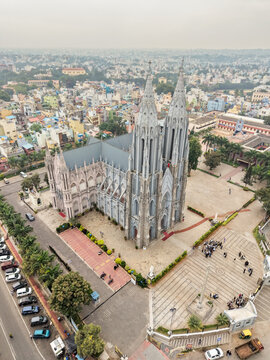 A scenic aerial view of the famous St. Philomena's Cathedral in Mysore cityscape, architecture, ancient, Neo-Gothic church, twin spires in India.