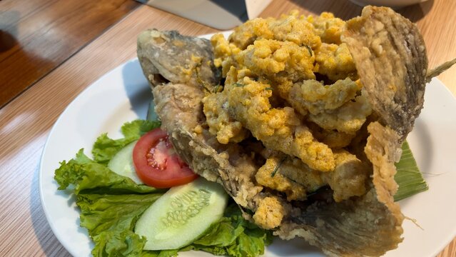 Fried Gourami with Salted Egg Sauce