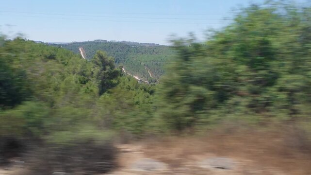 Scenic view of jerusalem hills from moving train