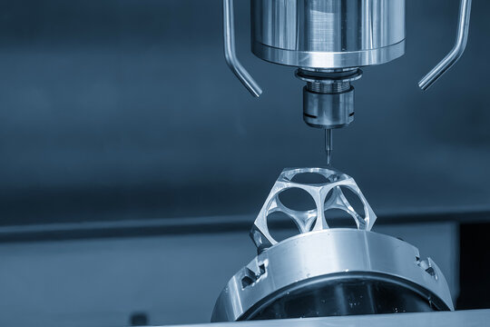 Metal parts cutting process on a CNC milling machine with a ball nose end mill tool in a light blue scene