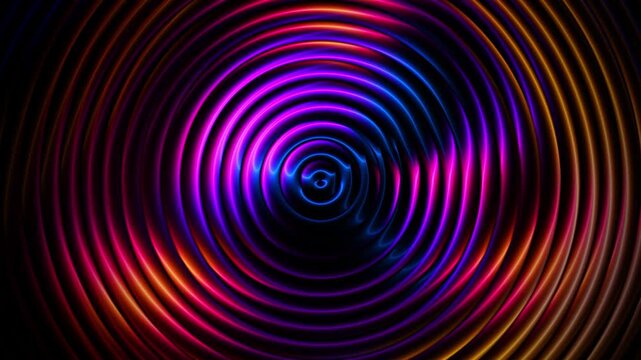 Glowing neon rings ripple outward creating mesmerizing colorful abstract patterns across dark surface