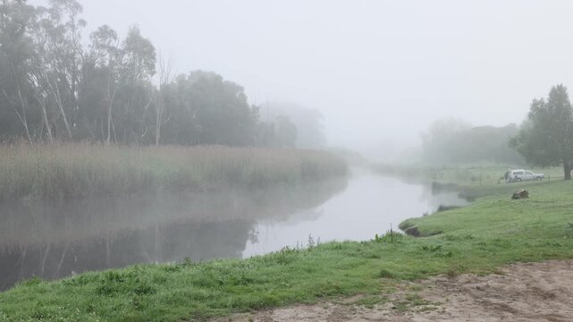 misty foggy sunrise over Klein River and reflections, Stanford, South Africa