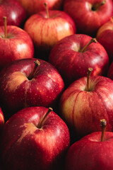 Close-up of ripe red apples pattern with selective focus and shallow depth of field. Macro...