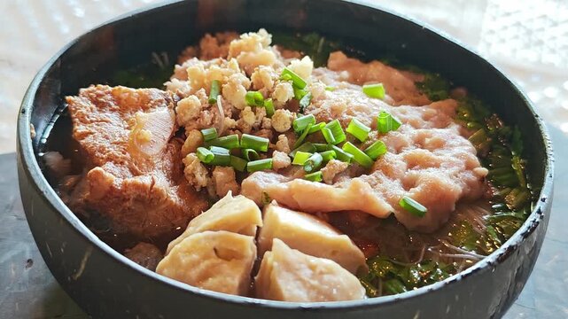 Noodles serve in a coconut shell instead of bowl