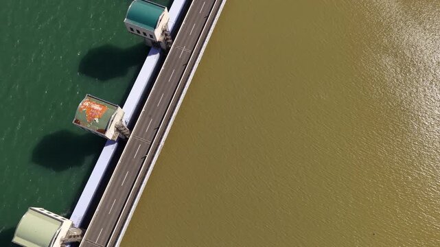 Aerial drone footage flying over Isahaya reclamation road bridge across Ariake Sea